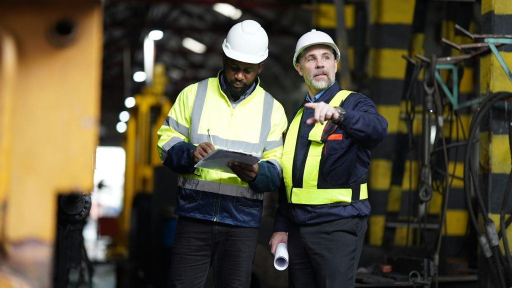 Portrait of maintenance engineer or apprentice in workshop of railway engineering facility